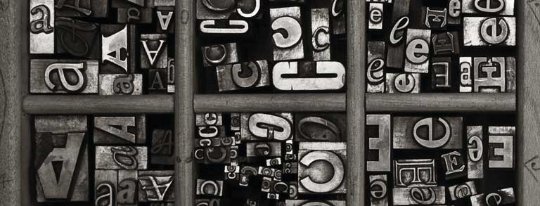 Graphic: A variety of ‘A’, ‘C’ and ‘E’ metal type sorts for handset letterpress printing in a resorting tray.